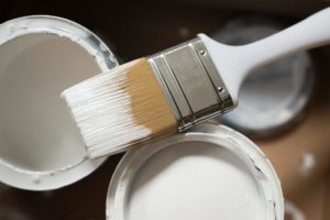 image of paint brush and paint cans